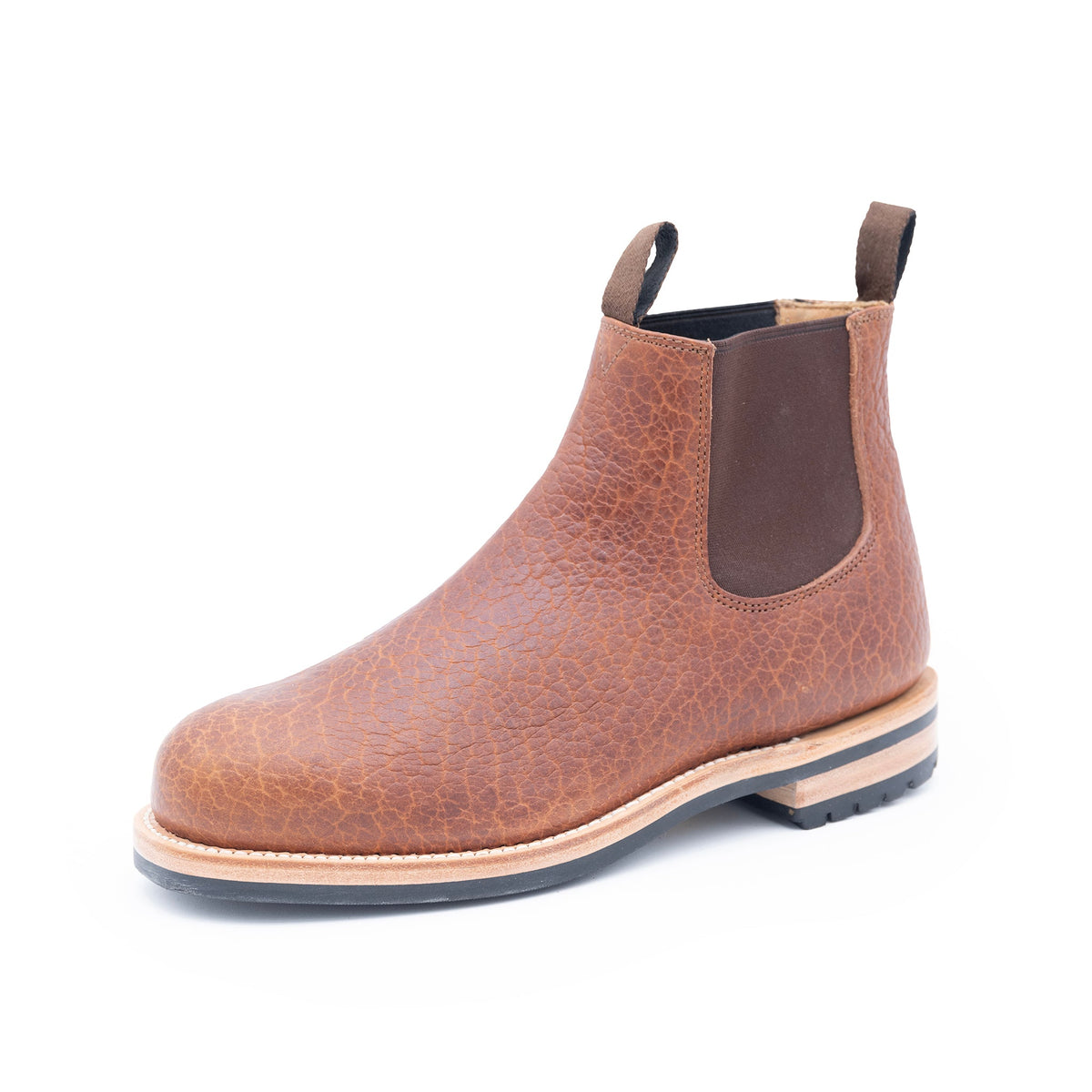 Brown leather Chelsea boot on a white background