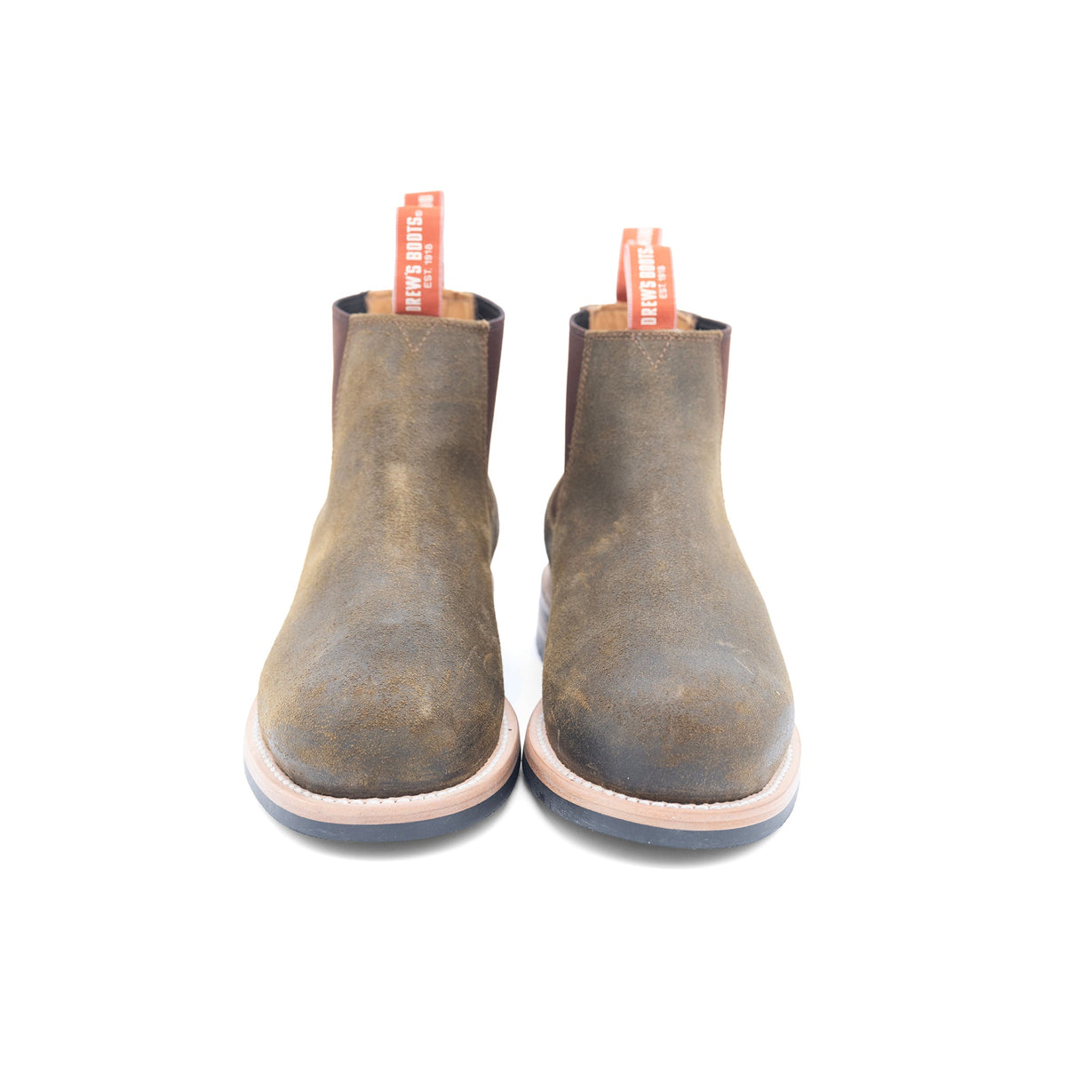 Pair of brown leather ankle boots on a white background