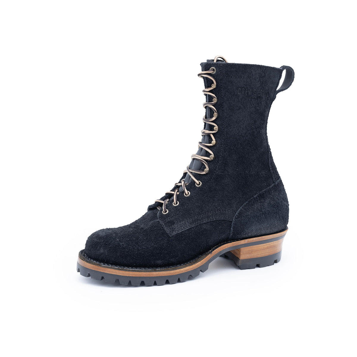 Black suede boot with brown sole on a white background